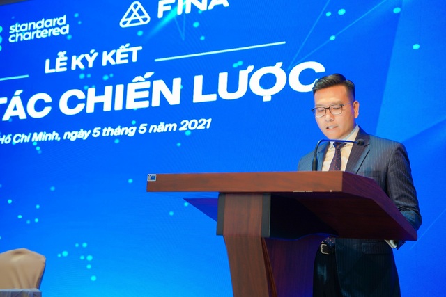 FINA hợp tác chiến lược  toàn diện cùng Standard Chartered Việt Nam - Ảnh 1.