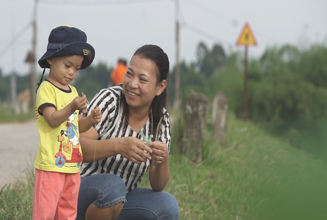 Nụ cười của con ch&iacute;nh l&agrave; sức mạnh của mẹ - Ảnh 1.