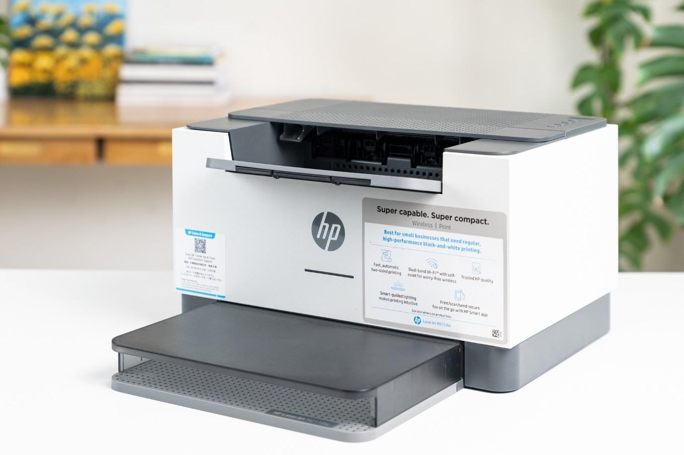 Máy in HP LaserJet M211dw trợ thủ siêu nhỏ gọn với tốc độ in ấn tượng - Ảnh 1.